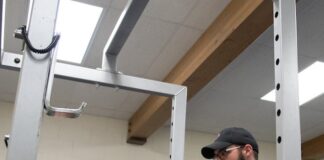 Spring Fitness Challenge winners announced Trainer and client in weight room