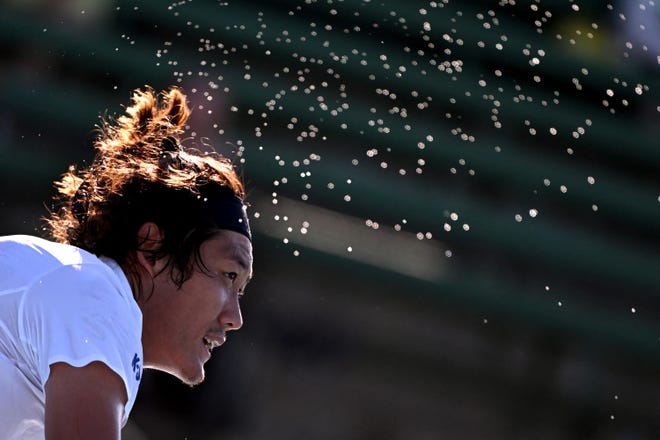 Tips to crush your physical activity goals This is a photo of sweat spraying from Zhang Zhizhen of China during a men's singles tennis match. Exercise of any form is important and celebrated on National Exercise Day.