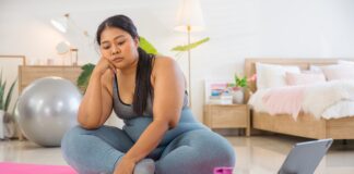 The Medical Minute: How to get started with physical fitness A woman sitting on an exercise mat and does not want to exercise.