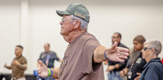 Community comes together for Veterans mental health summit Vet does Tai Chi during mental health summit