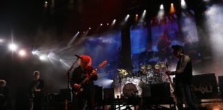 Legendary rock band hints at new album release date with billboards Mostly Sunny