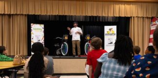 Students blend fitness and smoothie flavors Scott Simpson, executive chef for the Bay County School District, talks to students at Deer Point Elementary in Panama City about pedaling bikes to make healthy smoothies Sept. 20, 2024. The event was sponsored by Chartwells and Bay District Schools to promote wellness and nutrition.