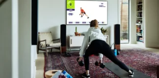 F45 Training Expands Wellness Focus with GLP-1 Medications woman working out with F45 at home on a Samsung TV