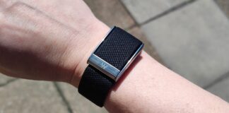 Users of the new Whoop MG fitness band are reporting widespread failures Whoop MG worn on man's wrist on street