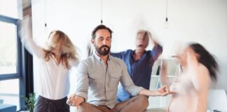 Elevating Corporate Culture Through Stress Relief and Energy Elevating corporate culture - sitting on table and meditating