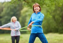 Regular aerobic exercise slows a key marker of brain aging in midlife Senior women are doing exercise with hoop for fitness and coordination