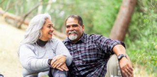 6 lifestyle changes to improve heart health and lower your risk of heart disease | Cultivating Health A senior couple enjoying a picnic on a blanket in the woods.