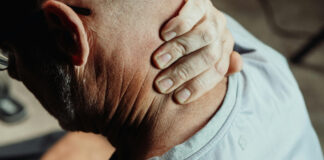 How Chronic Stress Accelerates Aging and Health Decline Man Having a Neck Pain