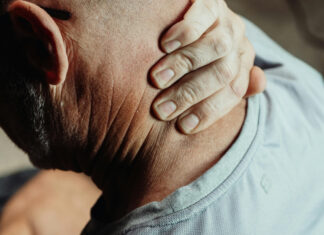 How Chronic Stress Accelerates Aging and Health Decline Man Having a Neck Pain
