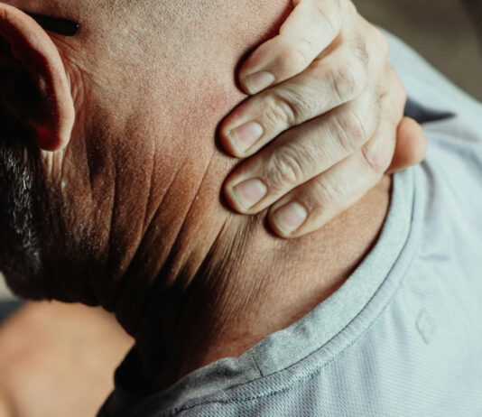 How Chronic Stress Accelerates Aging and Health Decline Man Having a Neck Pain