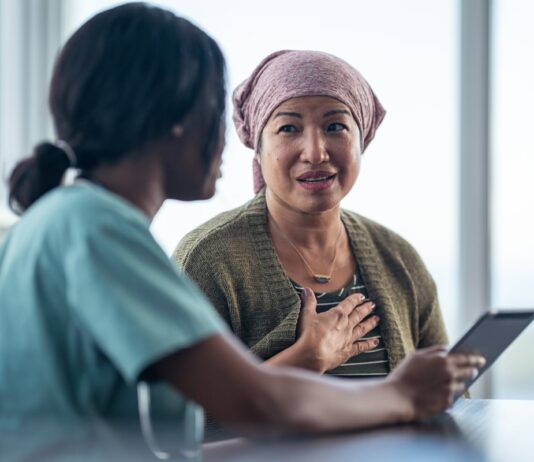 The Gene‑Therapy Breakthrough Story You'll Be Mad You Ignored at These Prices A medical professional talks to a patient.