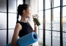Gen Z & Millennials Are Driving the High-Protein Diet Trend woman drinks a green shake
