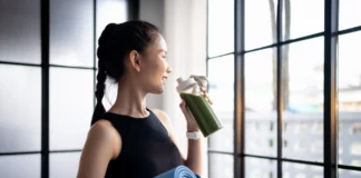Gen Z & Millennials Are Driving the High-Protein Diet Trend woman drinks a green shake